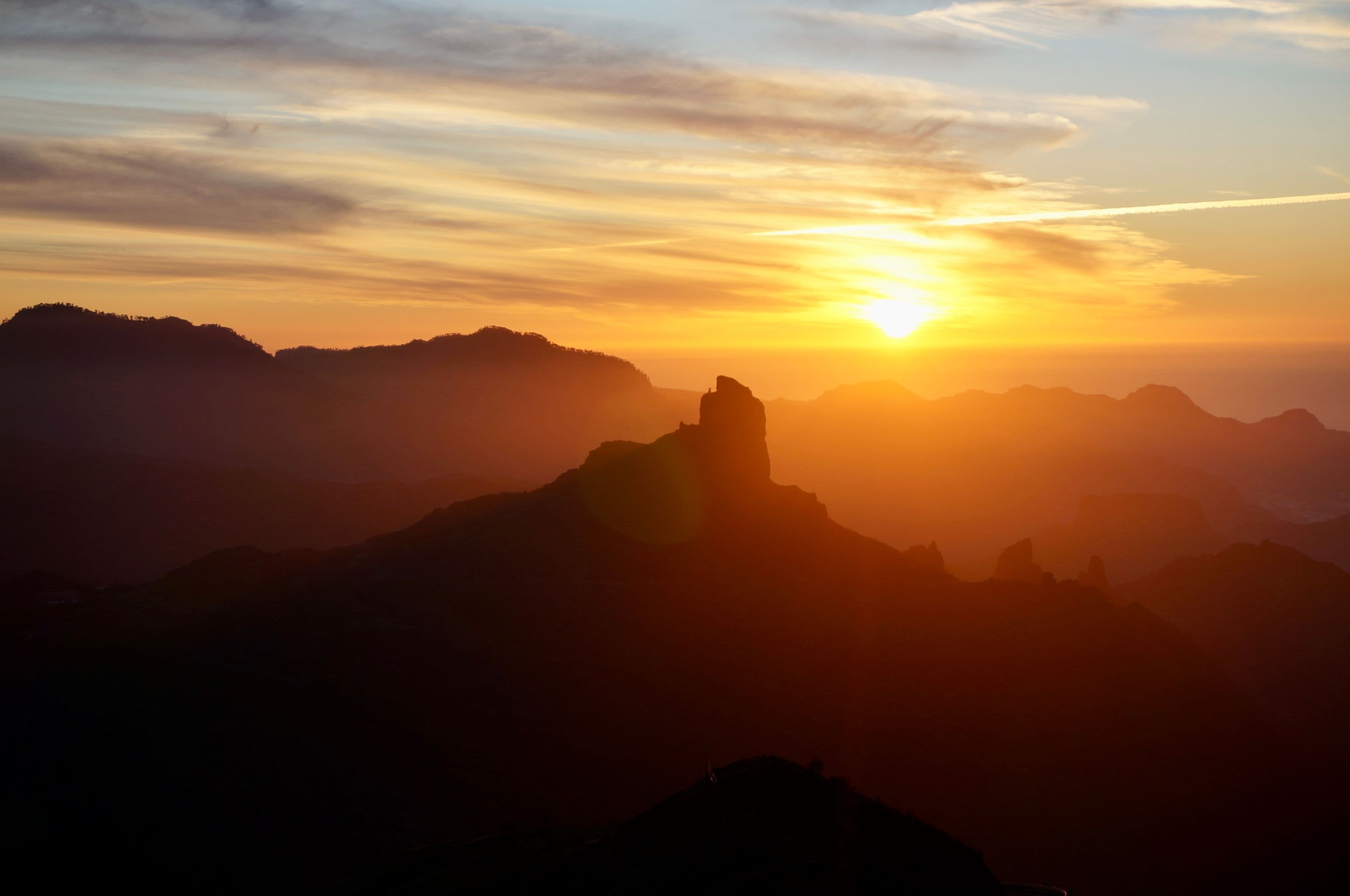 Roque Nublo silhouetted against the setting sun