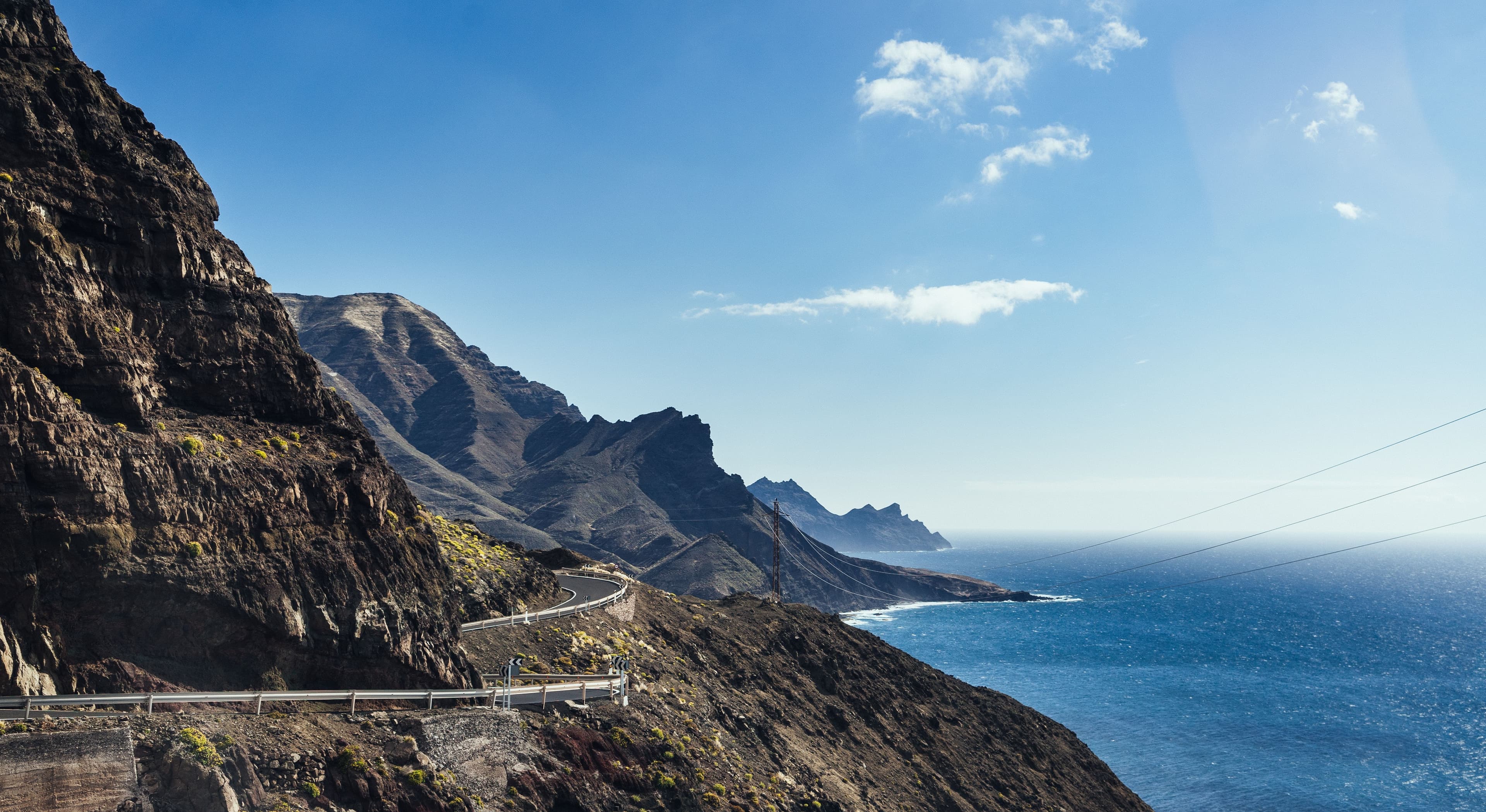A coastal cliff road on Gran Canaria in golden evening light